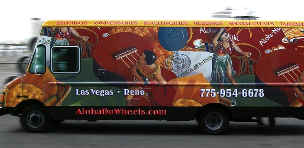 Hawaiian food truck with a red and yellow wrap.
