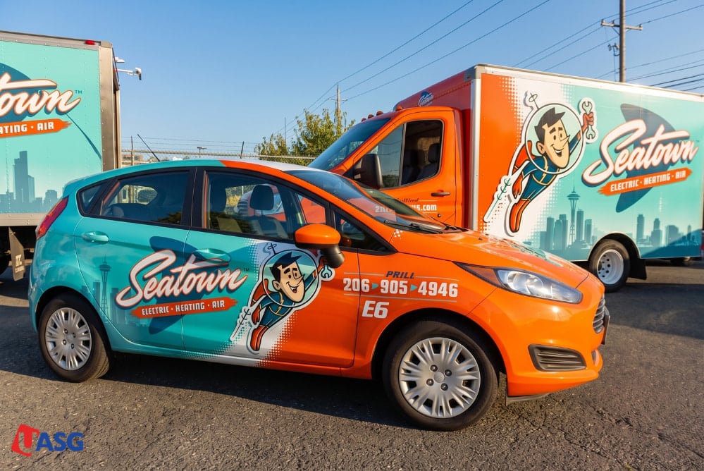 Professionally wrapped commercial car and box truck fleet with bold vinyl graphics by a 3M certified installer